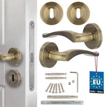 Klamka drzwiowa wewnętrzna krótki szyld dzielony z rozetą na klucz patyna